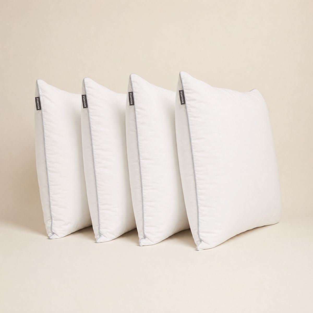 Four Haven hotel pillows standing in a row
