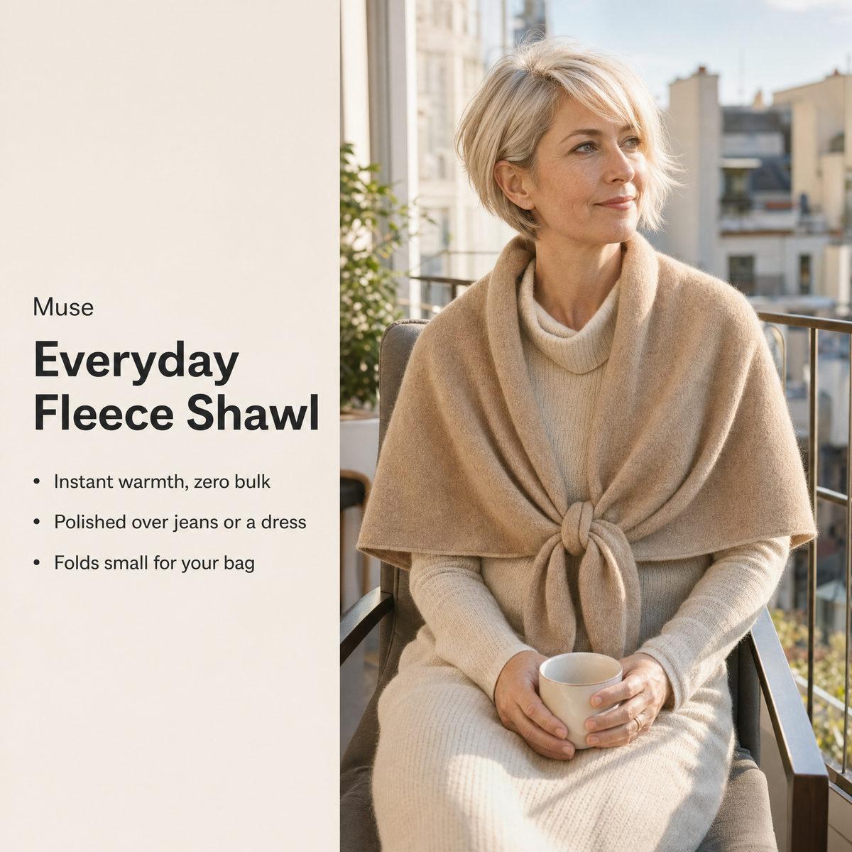 Woman with coffee on a balcony wearing the Muse shawl, key benefits
