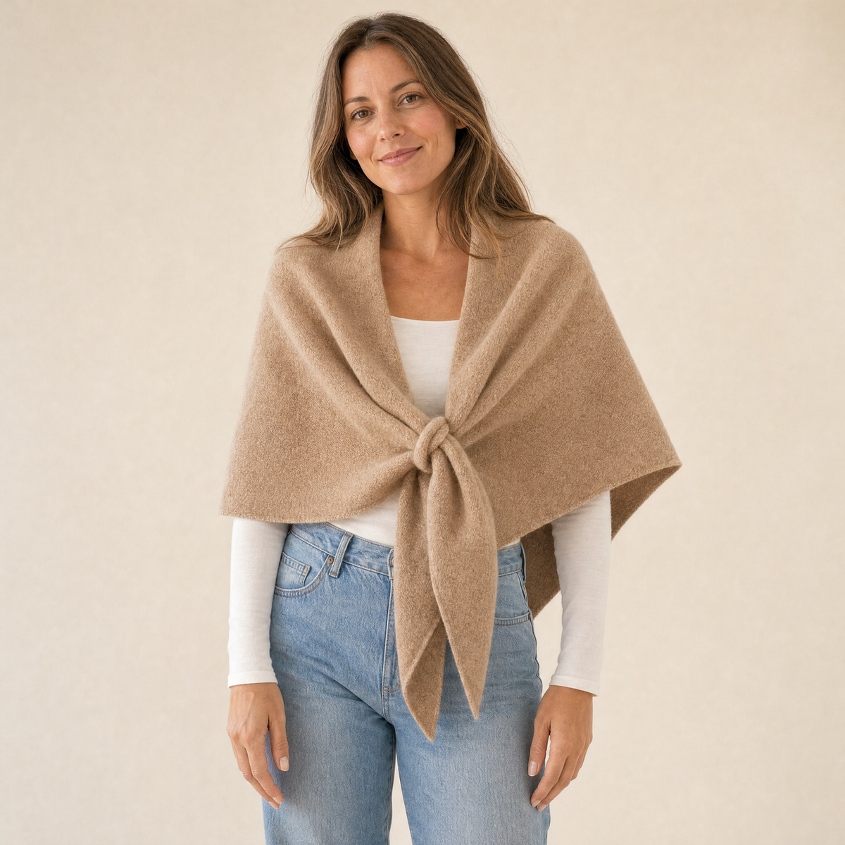 Woman wearing the Truenova Muse everyday fleece shawl in Caramel