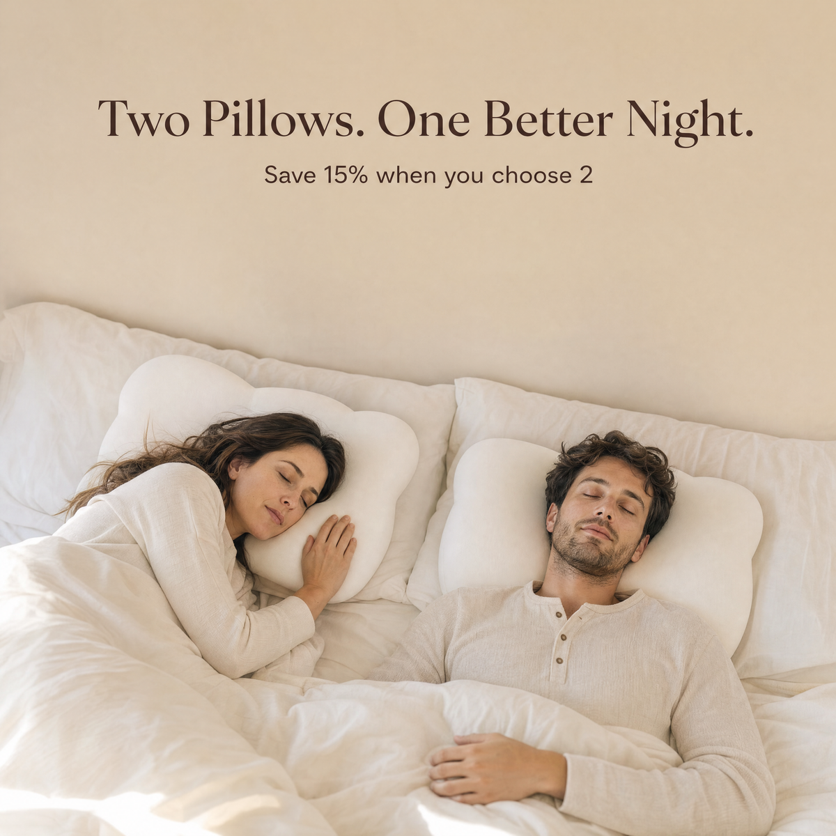 Couple sleeping on two Orbit pillows