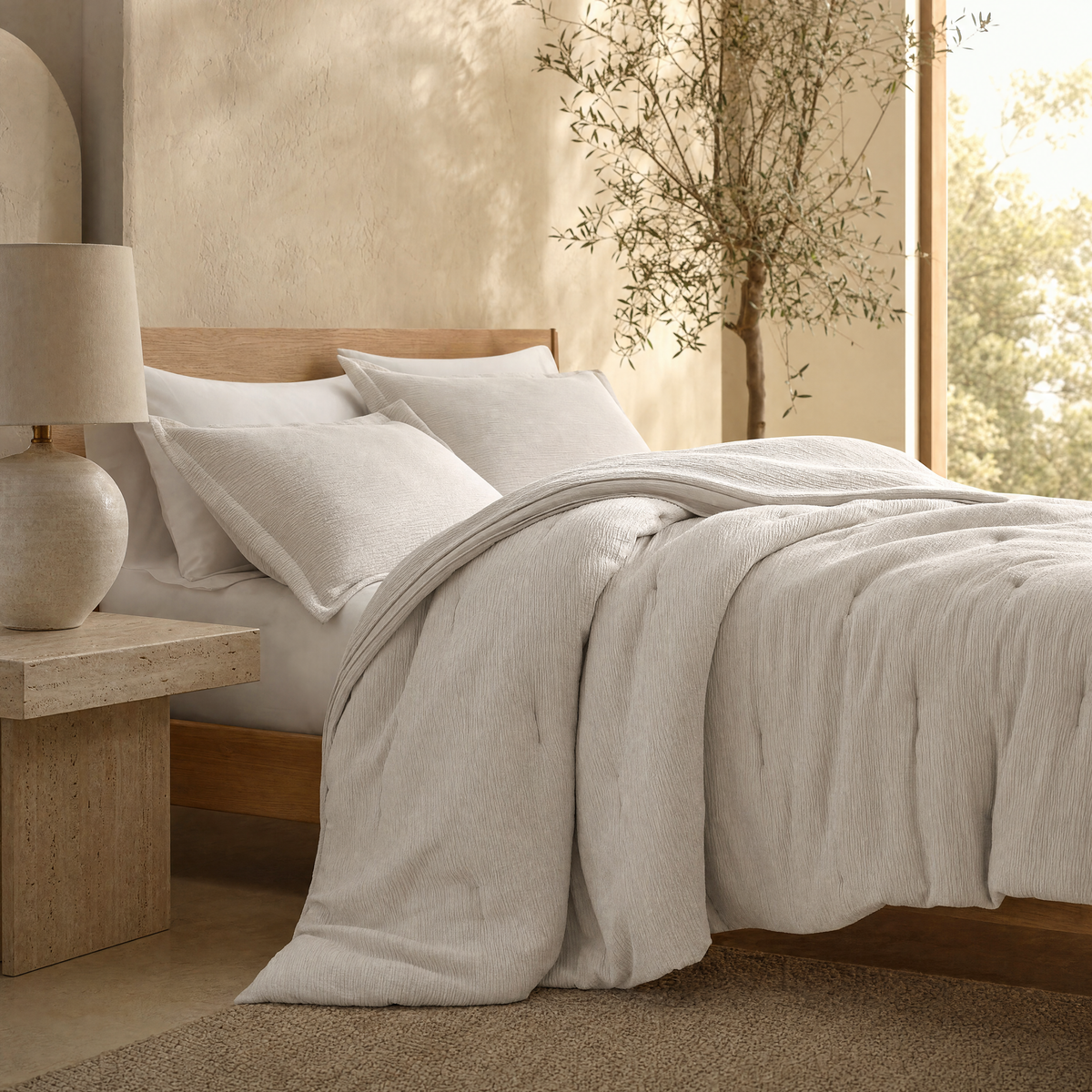 Drift comforter set on an oak bed in golden light