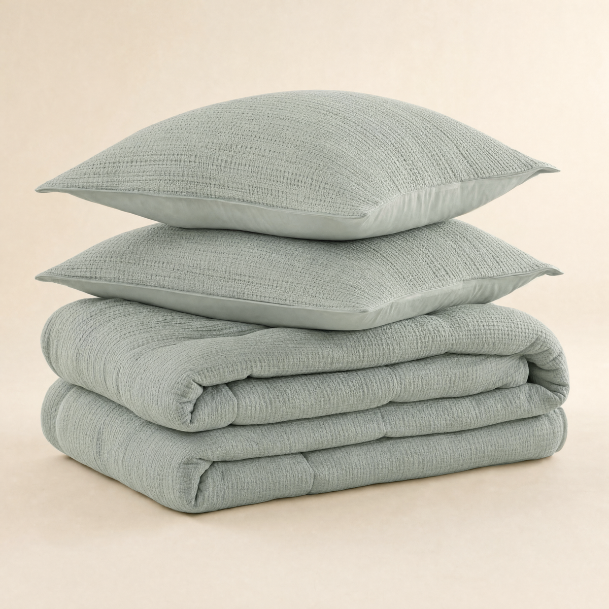 Ripple waffle comforter set in green mist, folded with shams