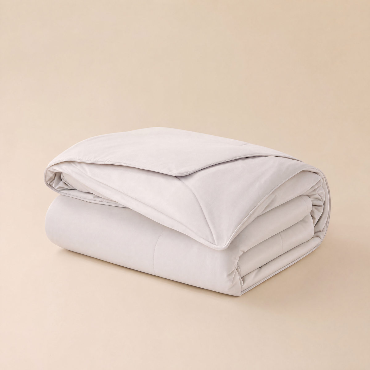 Frost dual-sided cooling comforter in white, folded