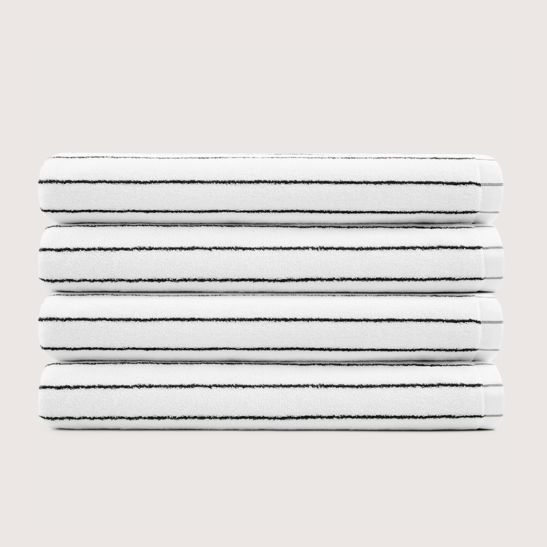 Pack of 4 Truenova Ultrasoft cotton bath sheets in Cloud White & Black stripe