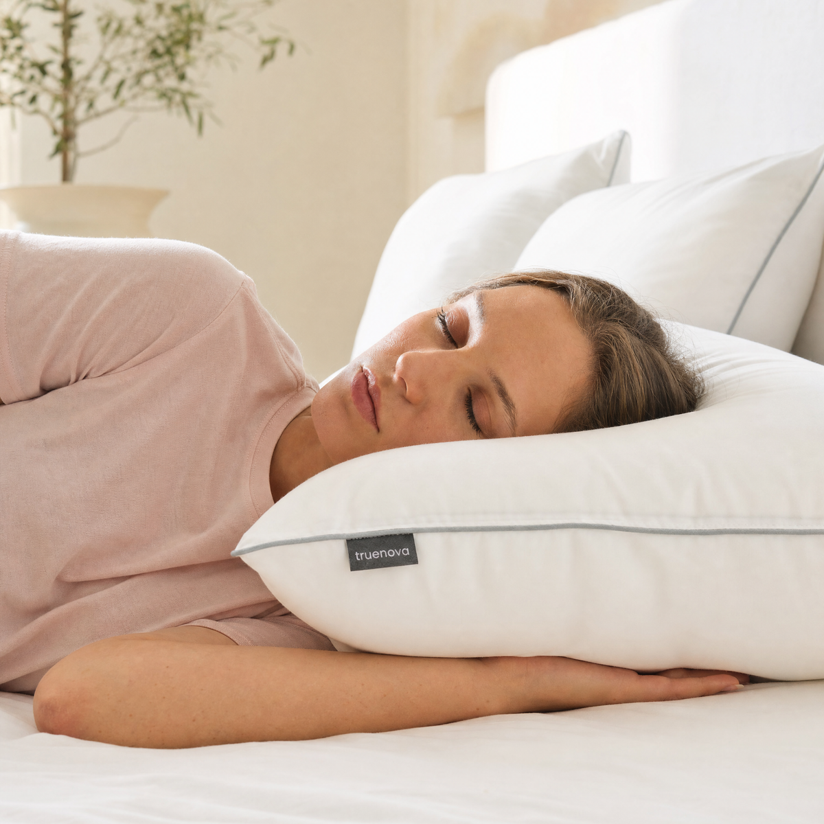 Woman side sleeping on the Haven hotel pillow