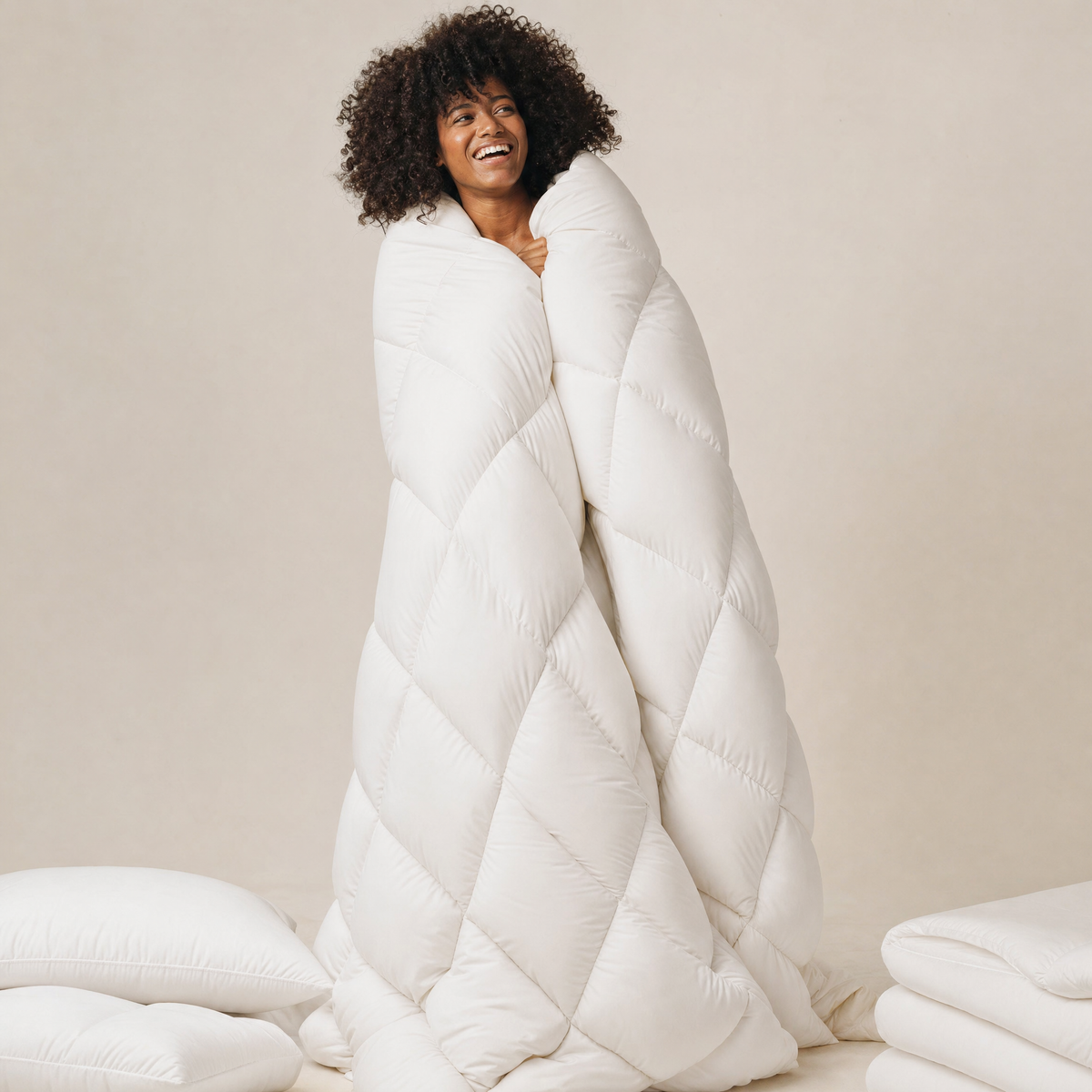 Woman wrapped in the White Halo comforter