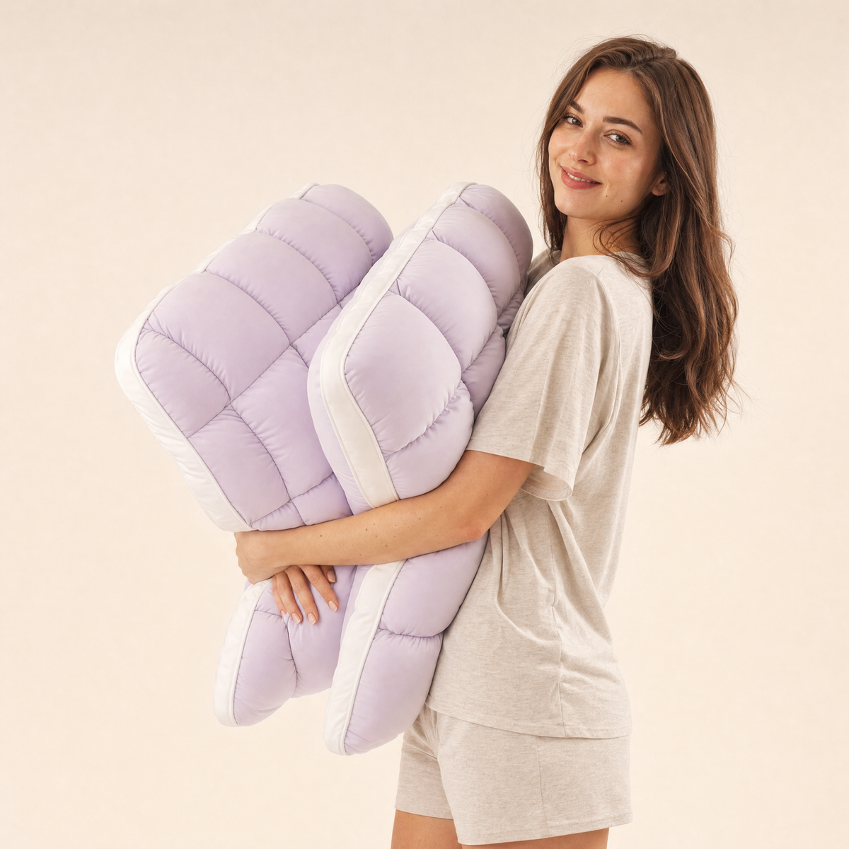 Woman hugging two Lavender Lune pillows