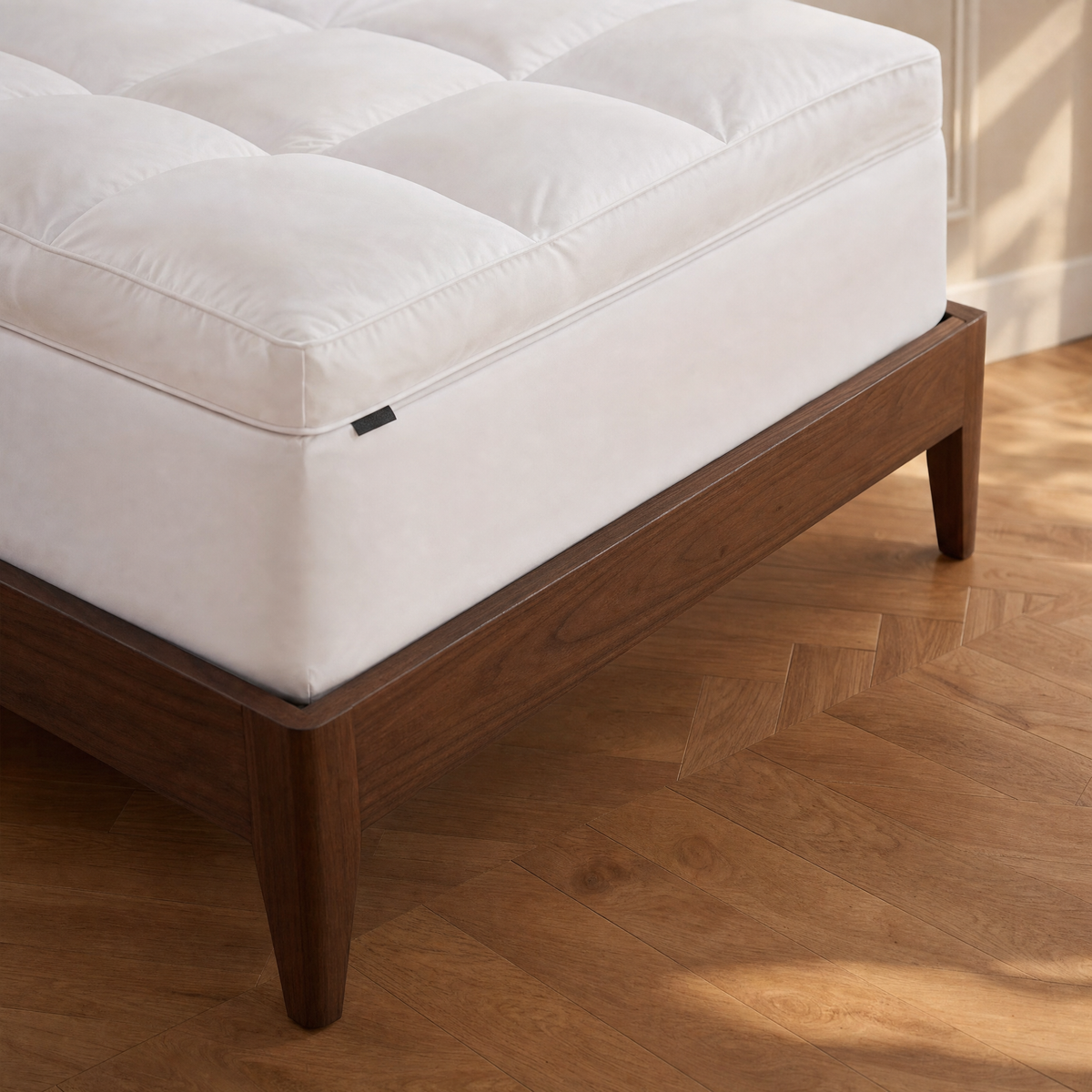 Thick plush loft of the Nimbus topper at the bed corner
