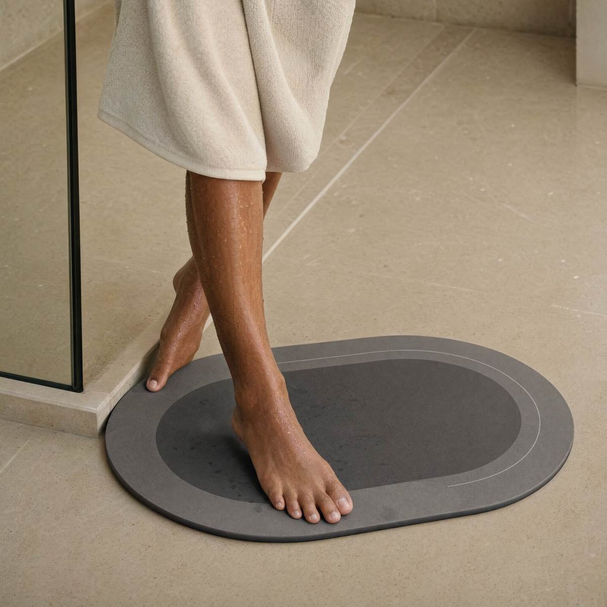 Stepping out of the shower onto the Pebble bath mat