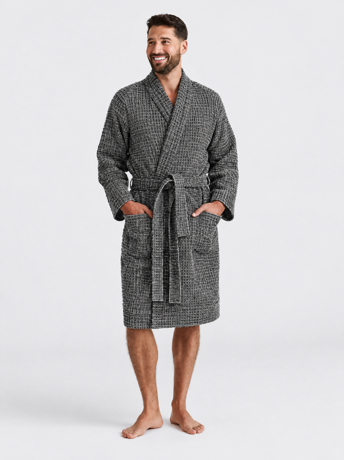 Man wearing the Truenova Waffle Robe in Grey