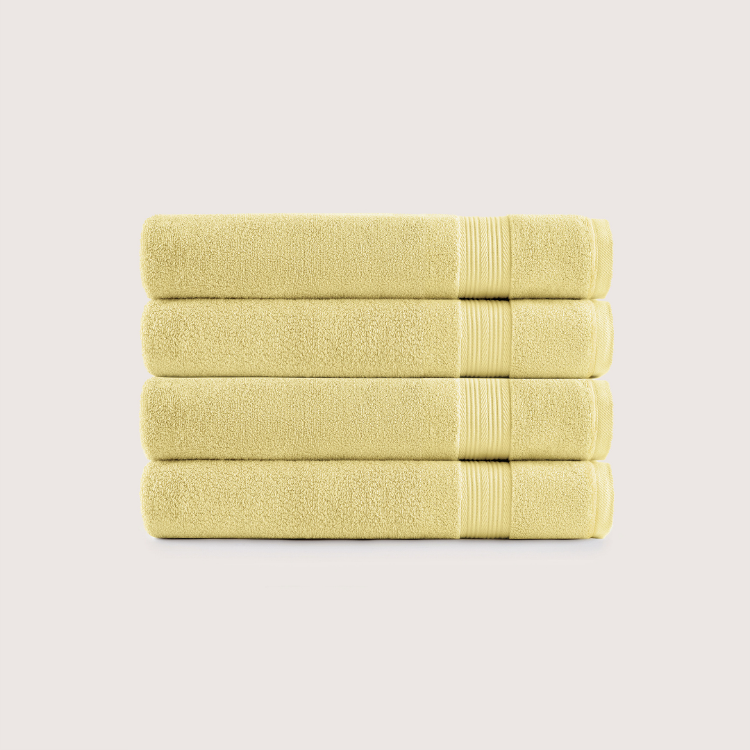 Pack of 4 Truenova Ultrasoft cotton bath towels in Butter Yellow